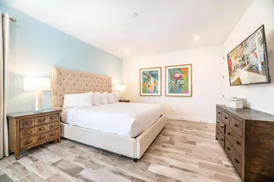 a bedroom with a large white bed and a dresser at Sky Blue Cottage With Private Pool Near Disney With Margaritaville Resort & Island H2O Access - 8045Kd in Orlando