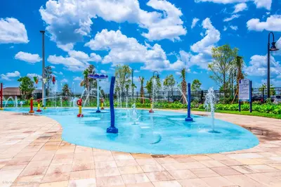 a playground with water fountains in a park at Lovely Private Pool Villa wFREE Resort Access in Kissimmee