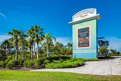 a sign at the entrance to a resort with palm trees at Margaritaville Cottage, PRIVATE POOL, Near Disney in Orlando