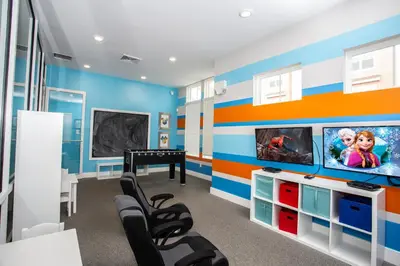 a playroom with blue and orange striped walls at Themed Disney House 5 min to Disney Parks, Heated Pool, Jacuzzi, Gym and more in Orlando