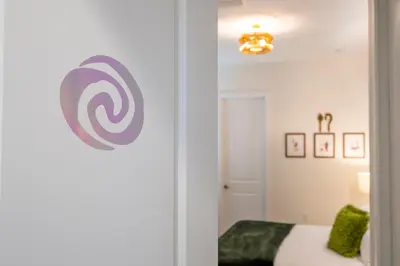 a room with a bed and a door with a spiral at Themed Disney House 5 min to Disney Parks, Heated Pool, Jacuzzi, Gym and more in Orlando