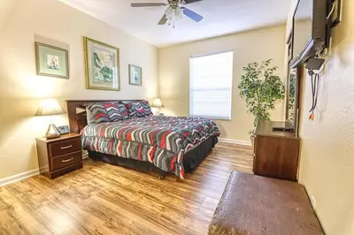 a bedroom with a bed and a ceiling fan at Windsor Palms Resort 3 Bedroom Condo 6 Miles to Disney in Kissimmee