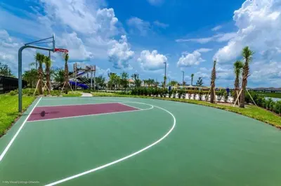 a basketball court in a park with palm trees at Great apartment in Storey Lake resort with great amenities next to Disney! in Kissimmee