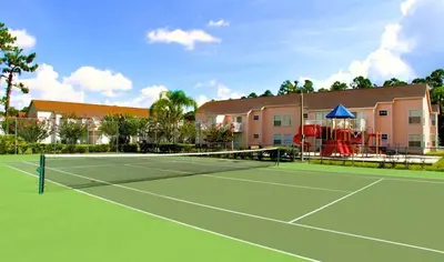 a tennis court in front of a building at Royal Palm Bay 3 Bedroom Condo Resort Pool 10 Min Disney in Kissimmee