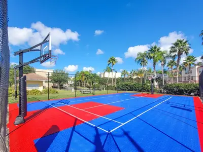 a basketball court with a basketball hoop at 2Br 2Bath Condo Balcony 5min Conv Center 1496ft in Orlando