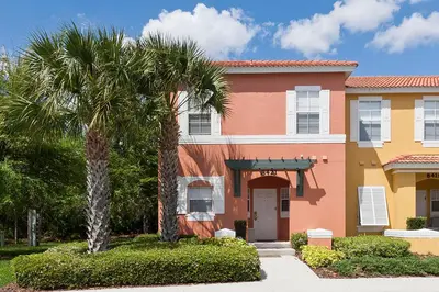 a palm tree in front of a house at 3Br 3Bath Private Townhome 10min Disney 1270ft in Kissimmee