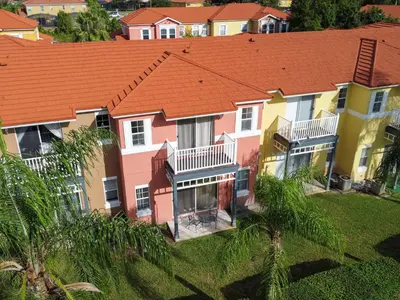 an aerial view of a house with orange roofs at Family Getaway Townhome at Lake Berkley 15min to Disney in Kissimmee