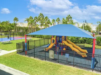 a playground with a slide in a park at 3Br 2Bath Condo Balcony 5min Conv Center 1388ft in Orlando