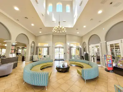 a lobby with couches and a table in a store at 4Br 2Bath Condo Balcony 5min Conv Center 2020ft in Orlando