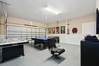 a room with a pool table and a ping pong table at 5Br 5Bath Pvt Home BBQ Pool 15min Disney 3056ft in Kissimmee