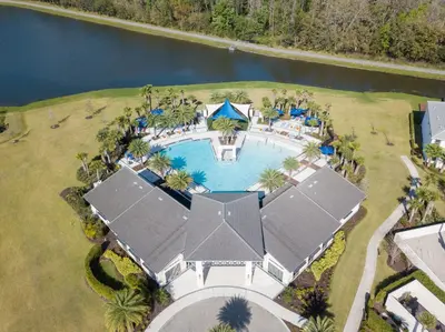 an aerial view of a house with a swimming pool at 5Br 5Bath Pvt Home BBQ Pool 15min Disney 3056ft in Kissimmee