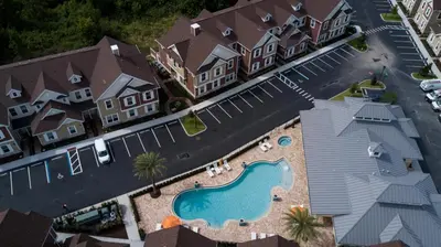 an aerial view of a house with a swimming pool at 3 BR 3BA 1678ft 5min Disneyworld Resort style in Orlando