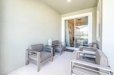 a waiting room with chairs and a window at 4 Bed Storey Lake Resort With Lazy River townhouse in Kissimmee