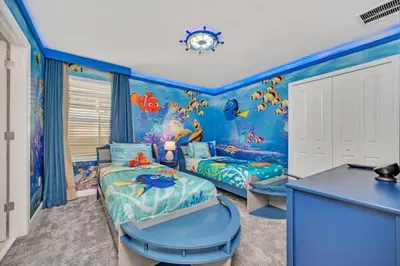 a childs room with a blue ocean themed bedroom at 9 Bed Storey Lake Villa Pictures Coming Soon home in Kissimmee