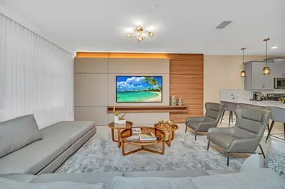 a living room with a couch and a table at 9 Bed Storey Lake Villa Pictures Coming Soon home in Kissimmee