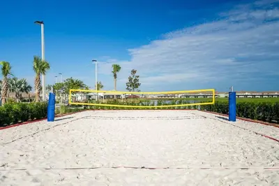 a volley ball net on a sandy beach at NEWLY LISTED Townhouse Storey Lake, Free Waterpark in Kissimmee