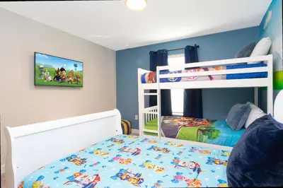 a bedroom with a bunk bed with a mickey mouse bed at Gorgeous 4 Bd w/ Pool at Champions Gate Resort 1020 in Orlando