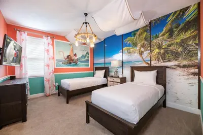 a bedroom with two beds and a painting of a beach at Modern Home With Pool Table Near Disney With Waterpark & Resort Access At Encore Resort - 7644Ff in Kissimmee