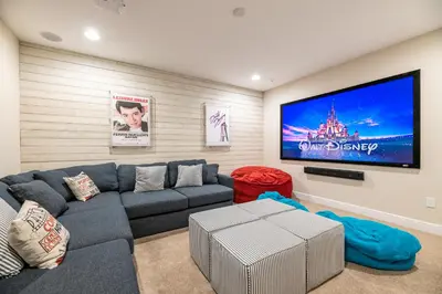 a living room with a couch and a flat screen tv at Modern Home With Pool Table Near Disney With Waterpark & Resort Access At Encore Resort - 7644Ff in Kissimmee