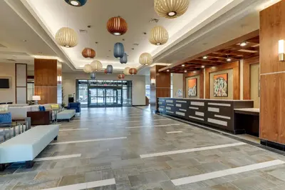 a lobby of a hotel with couches and tables at Drury Plaza Hotel Orlando - Disney Springs Area in Orlando