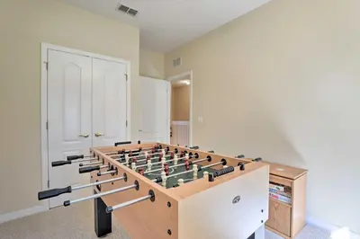 a large room with a large chess board in it at 6 Mi to WDW Family-Friendly Townhome with Foosball! in Kissimmee