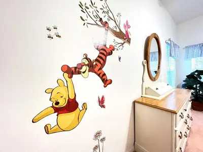 a winnie the pooh wall sticker in a room at Mickeys Homestead - Stylish 4BR Lakefront Cottage with Huge South Facing Pool Hot Tub BBQ - 2 miles Disney! in Orlando