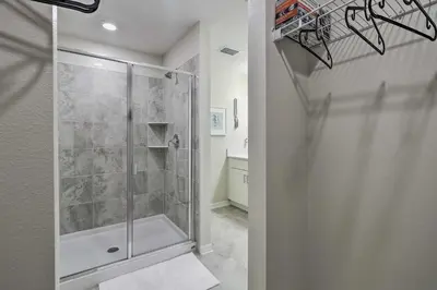 a shower with a glass door in a bathroom at Kissimmee Condo about 10 Mi to Disney Attractions in Kissimmee