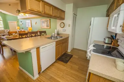 a kitchen with a sink and a counter top at 3 Bedroom Resort Condo 8 Miles to Disney Pool Free Parking in Kissimmee