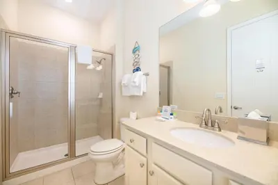 a bathroom with a shower and a toilet and a sink at Comfortable Cottage Near Disney With Margaritaville Resort & Island H20 Waterpark Access - 3017Sp in Orlando