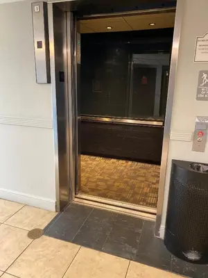 an entrance to an elevator in a building at Spacious Studio close to Theme Parks in Orlando