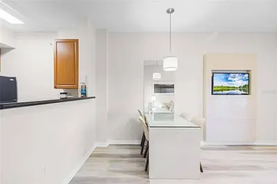 a kitchen with white walls and a counter top at Premier Resort Condos Near Disney & Universal in Orlando