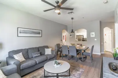 a living room with a couch and a table at 2821 Windsor Hills in Orlando