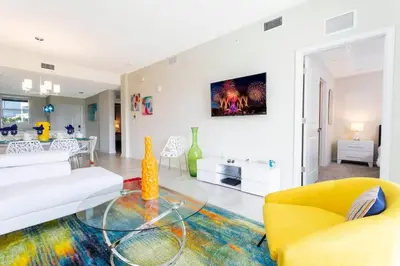 a living room with a couch and a table at Family Friendly 2 Bd Close to Disney @ Storey Lake 105 3161 in Kissimmee