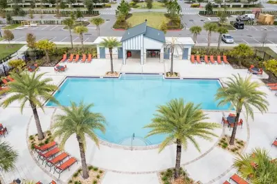 an overhead view of a large swimming pool with palm trees at Family Friendly 2 Bd Close to Disney @ Storey Lake 105 3161 in Kissimmee