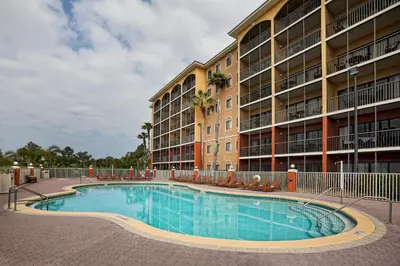 a swimming pool in front of a apartment building at Westgate Towers Resort in Orlando