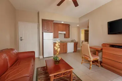 a living room with a couch and a kitchen at Westgate Town Center Resort in Orlando