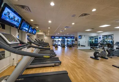 a gym with several treadmills and cardio machines at Westgate Vacation Villas Resort in Orlando
