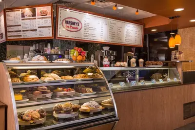 a bakery with a display case filled with pastries at Westgate Lakes Resort and Spa in Orlando