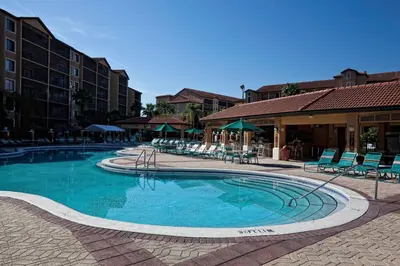 a large swimming pool with chairs and tables at Westgate Lakes Resort and Spa in Orlando