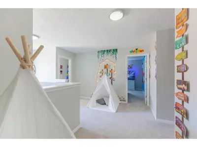 a childs room with a play tent and a play house at Best place to unwind and have lots of fun! in Kissimmee