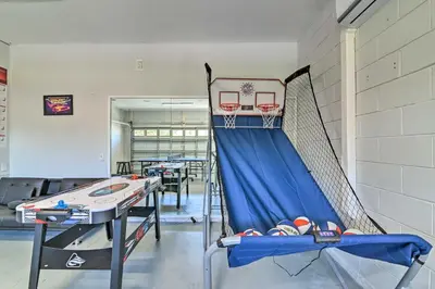 a gym with a basketball hoop and a net at 5 Mi to Disney World Retreat with Pool and Lanai! in Kissimmee