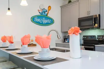 a kitchen with a counter with four cups on it at Wonderful 5 Bd Close to Disney @ Storey Lake Resort 2980 in Kissimmee