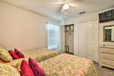 a bedroom with two beds and a window at No Pet Fee! Snowbird Haven in Lake Worth Beach! in Orlando