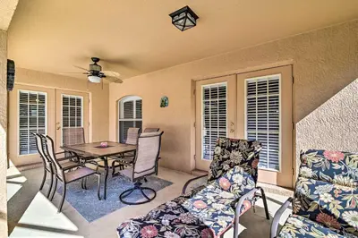 a living room with a table and chairs at No Pet Fee! Snowbird Haven in Lake Worth Beach! in Orlando