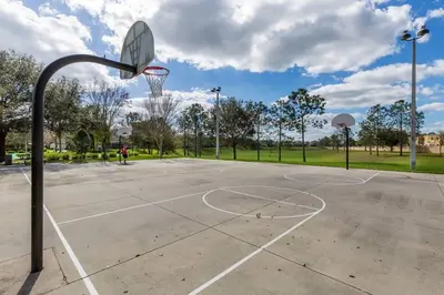an empty basketball court with a hoop at 3 bedroom Disney Condo Windsor Hills in Orlando