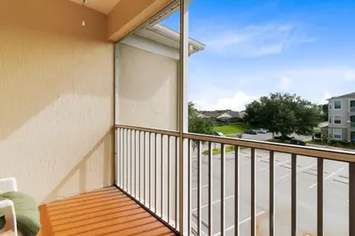 a balcony with a view of a street at Amazing Resort 2 bed condo close to Disney condo in Kissimmee