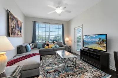 a living room with a couch and a flat screen tv at Windsor Palms 3 bed Condo in Gated Resort condo in Kissimmee