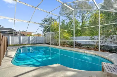 an indoor swimming pool with a glass igloo at Elegant Villa Pool Fun Game Room Near Disney in Kissimmee