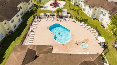 an overhead view of a swimming pool in a yard at Beautiful, cozy and spacious Retreat near Disney in Kissimmee