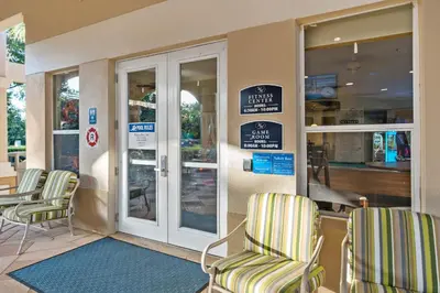 a store front with chairs and signs on the door at WH2618DS Windsor Hills Retreat in Orlando